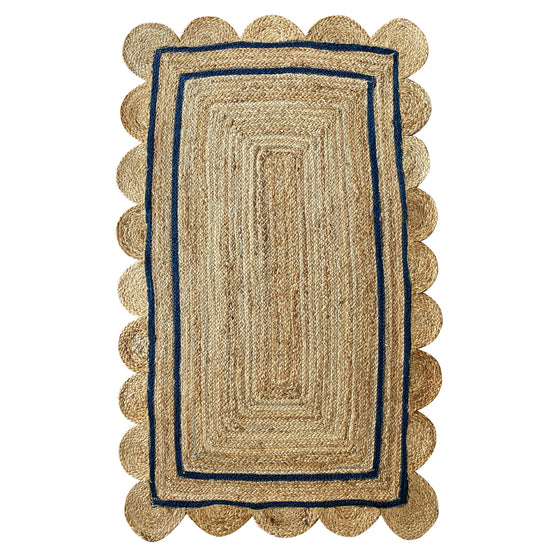 Scallop edge jute rug with classic blue trim